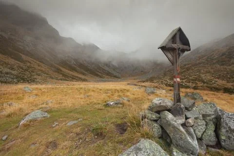 A crucifix long a mountain path in Altoadige, Italy Stock Photos