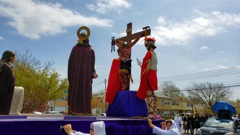 Crucifix procession through streets of Bayside NY Stock Footage 107274575