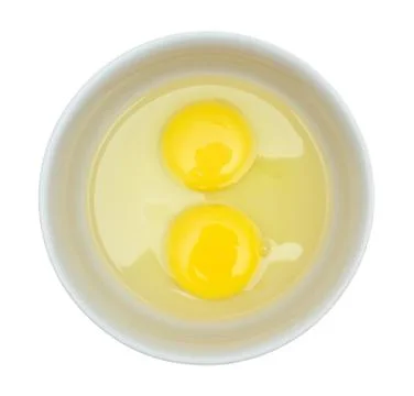 Crude eggs in a plate. Stock Photos