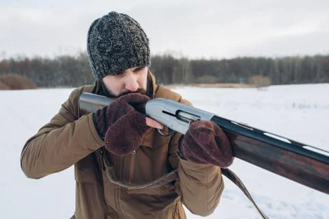 Cruel hunter aiming at animals Фото