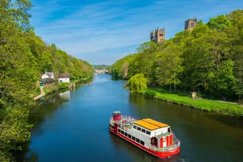 A cruise boat cruises along River Wear on a beautiful spring day in Durham, U Stock Photos