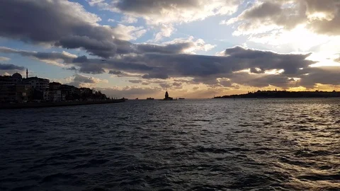 Cruise Bosphorus in sunset time going to Maiden's tower - skyline of Istanbul Stock Footage 129814652