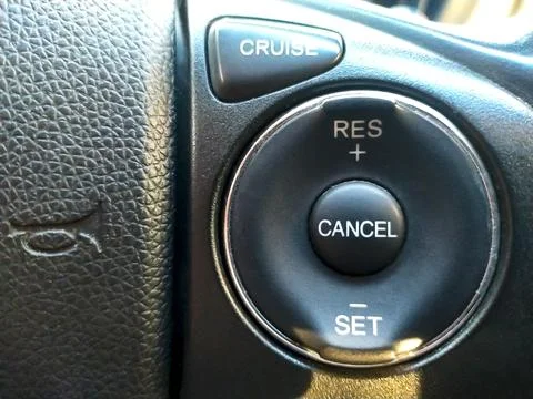 Cruise control button in conventional modern car. Car instrument panel, int.. Photos