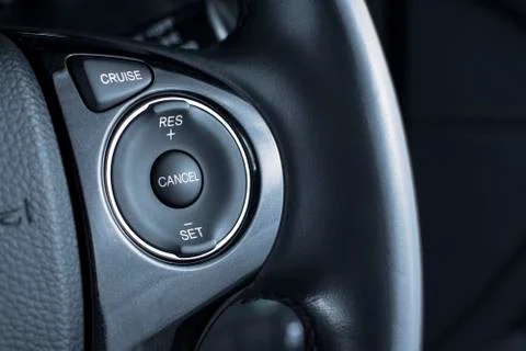 Cruise control button switch on steering wheel. 스톡 사진