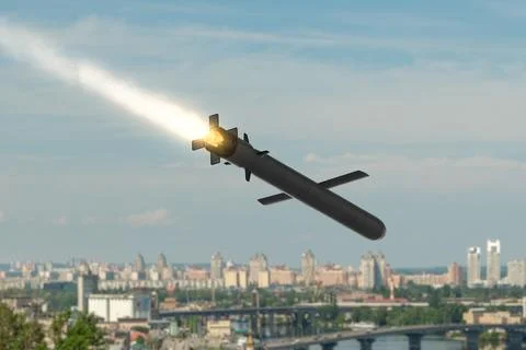 Cruise missile with an operating jet engine flying at low altitude above a .. Foto stock