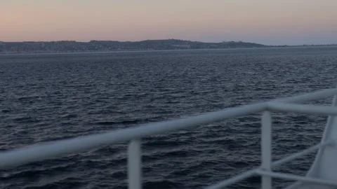 Cruise navigation at sunset. Visual from the ship or the boat. Tourism concept Stock Footage 138236674
