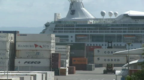 Cruise ship behind containers plus forklifts Stock Footage 628984