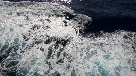 Cruise ship creates foaming wake as it sailing through waters of Drake Passage Видео 335194833