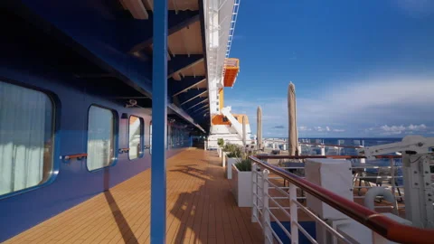 Cruise Ship Deck Walkway with Ocean Views and Outdoor Seating Area. Vídeos de archivo 341993090