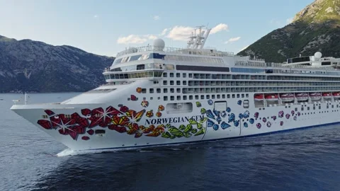 Cruise Ship Decorated Bow Below Green Mountain Aerial View Stock Footage 344278889