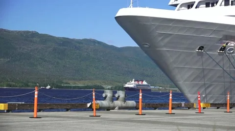 Cruise ship docked ,distant ship arriving Stock Footage 53447213