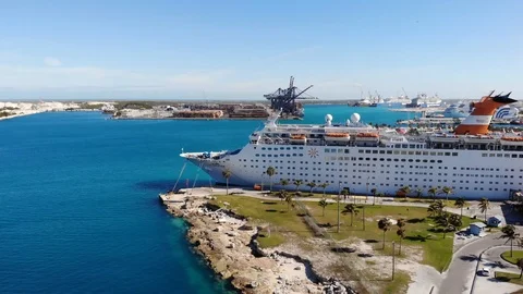 Cruise Ship Docked in Freeport Harbor Bahamas on Clear Sunny Day Stock Footage 103066671