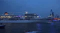 Cruise ship Europa leaving blue illuminated Hamburg harbour HD Footage