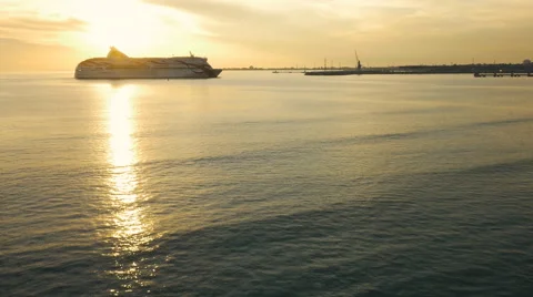 Cruise ship Moving to Docks in Sunset Light Stock Footage 64934906