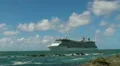 cruise ship near rocks close to shore HD Footage