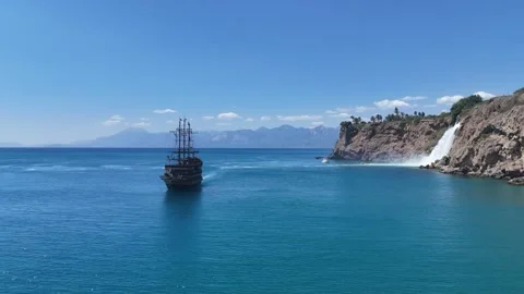 Cruise ship next to Düden Waterfall in Mediterranean sea Video stock 344028897