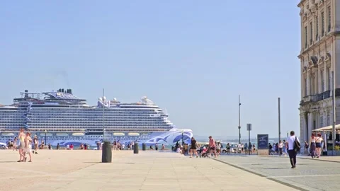 Cruise ship Norwegian Viva pass by Lisbon Praca do Comercio at sunny day Stock Footage 289831153