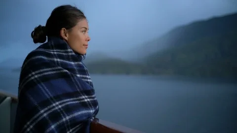 Cruise ship passenger on Alaska travel vacation enjoying scenery at dusk Stock Footage 122266039