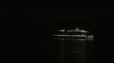 Cruise ship passing at night Stock Footage