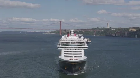 Cruise Ship Passing Under 25 de Abril Bridge in Lisbon Portugal Stock Footage 340462601