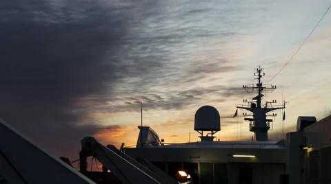 Cruise ship radar surrounded by a set of antennas, sunset Stockbeeldmateriaal 60401030