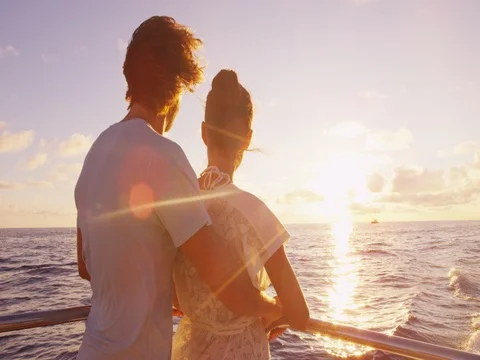 Cruise ship - Romantic couple enjoying sunset over the ocean on cruise ship Stock-Footage 77197341