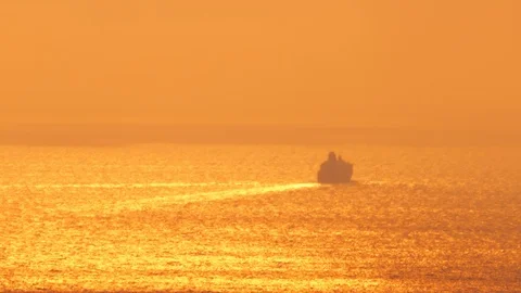 Cruise ship sailing into sunset Stock Footage 103963902