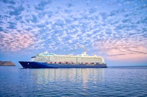 Cruise ship sailing under a dramatic sky. Fotos Stock