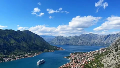 A cruise ship sails through the breathtaking Bay of Kotor, Montenegro Stock Footage 305831206
