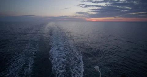 Cruise ship sunset back .sunset on the sea taken from the ship Stock Footage 240144123