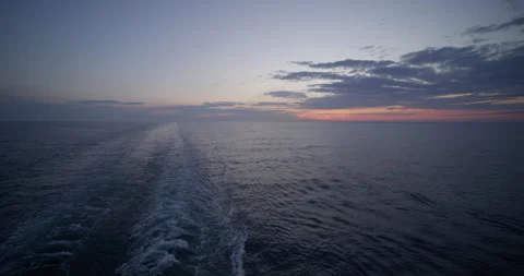 Cruise ship sunset back .sunset on the sea taken from the ship Stock Footage 240144146