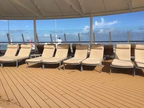 Cruise ship upper deck lounge chairs from right JPG Stock Photos
