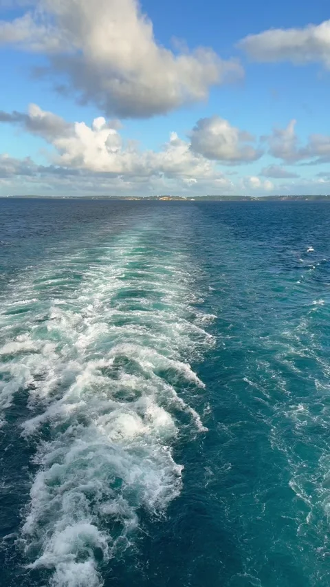 A cruise ship wake in the Atlantic Ocean on a sunny day Stock Footage 327879366
