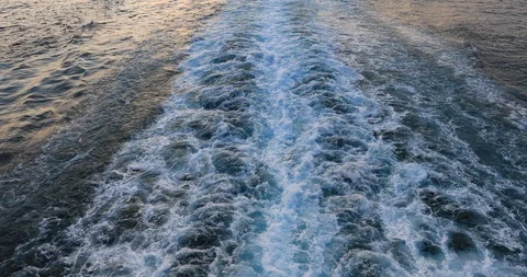 Cruise ship wake Pacific ocean beautiful sunset on water 4K Stock Footage 108702147