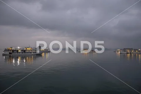 Cruise ships at sunset in Ha Long Bay Vietnam Stock Photos