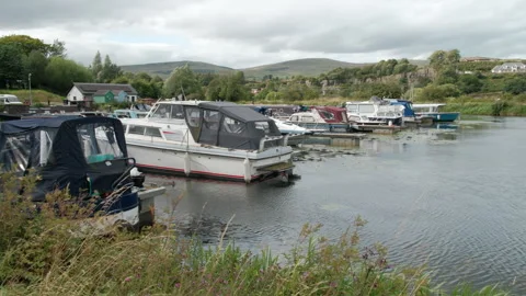 Cruisers along the Forth and Clyde Canal at Auchinstarry Marina in Scotland Stock Footage 303380666