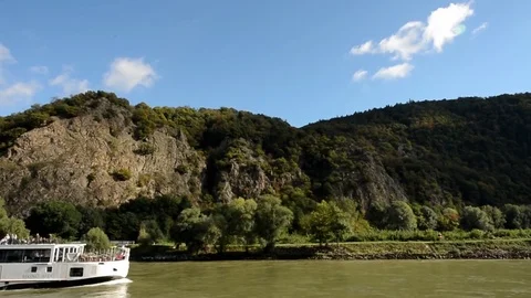 Cruising the Danube River as another Cruise Ship passes by in Austria Stock Footage