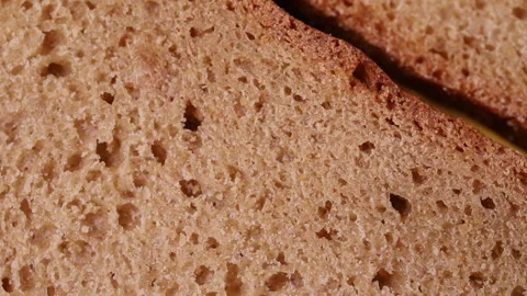 The crumb of bread rotates slowly. macro background Stock Footage 118468599