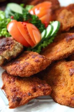 Crumbed meat on a buffet table Stock Photos