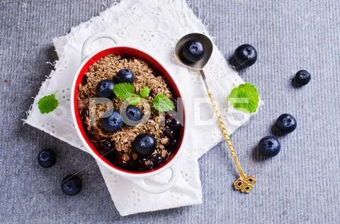 Crumble with blueberries Stock Photos