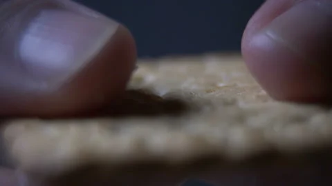 Crumbles baking breaks in hands, macro shoot Stock Footage 86627176