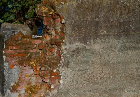 Crumbling brick wall Stock Photos