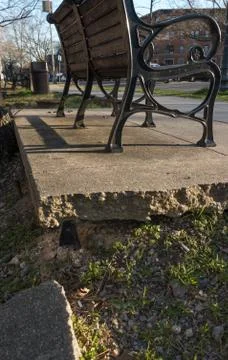 Crumbling cement infrastructure under bench Stock Photos