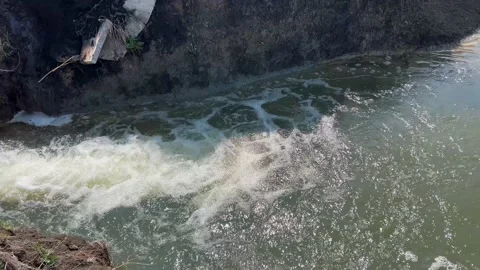 Crumbling concrete pipe transporting the polluted wastewater Stock Footage 237879172