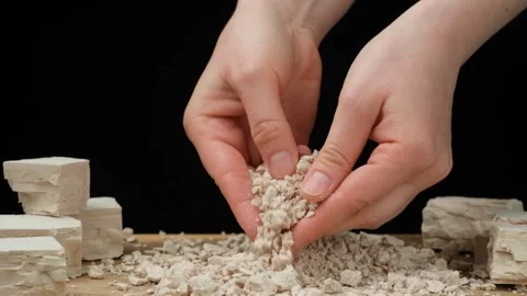 Crumbling moist yeast block by hands slow motion Stock Footage 310250991