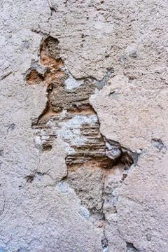 Crumbling plaster on the old wall Stock Photos
