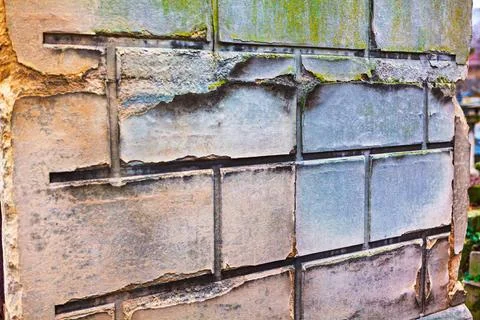 Crumbling stone wall with rectangular blocks Foto stock