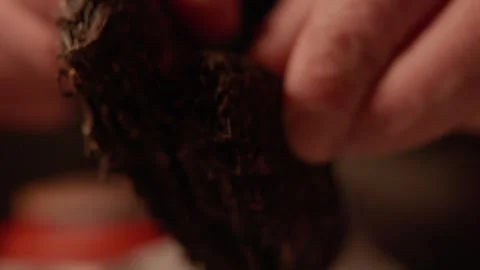 Crumbling Tea Bricks Tapped in Hands Stock Footage 321889798