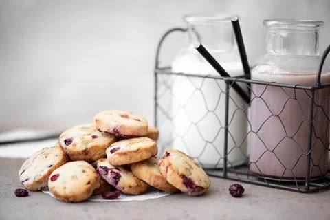 Crumbly cookies with cranberry, with milk and cocoa Stock Photos