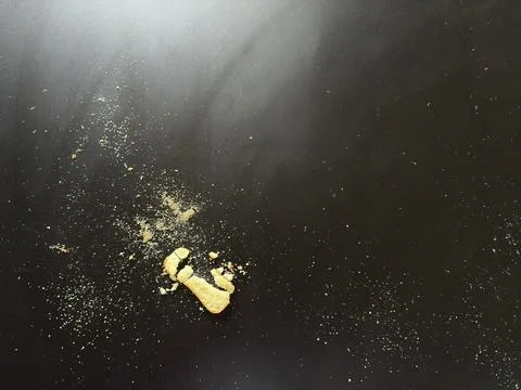 Crumbs on Dark Table Stock Photos